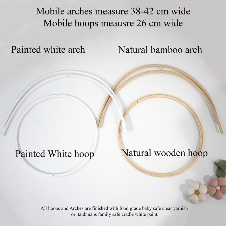 May include: A set of mobile components including a painted white arch and hoop, and a natural bamboo arch and wooden hoop. Text states mobile arches measure 38-42 cm wide and mobile hoops measure 26 cm wide, with a food grade baby safe finish.