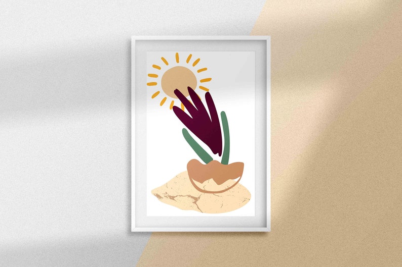 May include: A framed print with a minimalist abstract design featuring a stylized sun, a purple flower, and green leaves on a beige background.