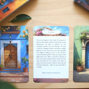 May include: Oracle cards with illustrations of doors and buildings, including one with the text "True Love". The cards are displayed on a wooden surface. The images evoke themes of guidance and self-reflection, with a focus on love.