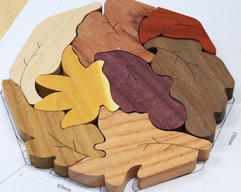 May include: A wooden hexagon leaf puzzle with six pieces, each a different color and shape. The puzzle measures 6.2 inches by 7.5 inches.