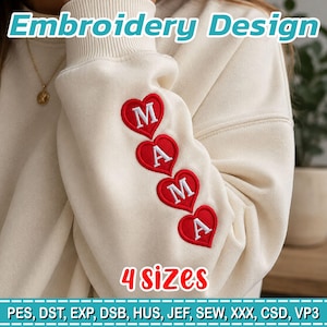 Puede incluir: Una sudadera color crema con un diseño de bordado en la manga. El diseño consta de cuatro corazones rojos dispuestos verticalmente, cada uno con una letra blanca que forma la palabra MAMA. El texto Embroidery Design y 4 sizes es visible.