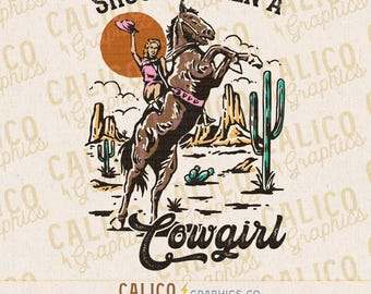 May include: A vintage-style graphic featuring a cowgirl riding a rearing horse in a desert landscape. The design includes the text "SHOULDA BEEN A Cowgirl" in a stylized font, with a sun and cacti. The image is a digital download.