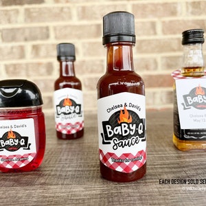 Personalized Baby-Q baby shower favor bottles with gingham labels, including barbecue sauce, liquor bottles, and hand sanitizer favors for BBQ themed baby shower.