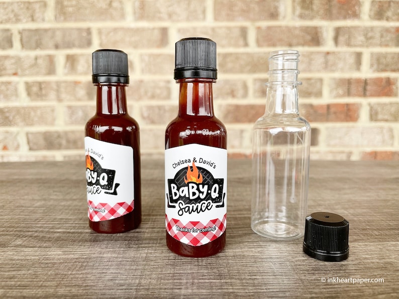 Mini 50ml bottles with personalized Baby-Q labels featuring flame and grill design and gingham pattern