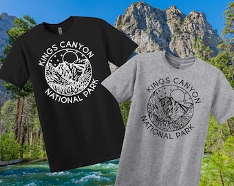 May include: Two t-shirts, one black and one grey, each with a circular graphic. The graphic reads "Kings Canyon National Park" and features a mountain range, sun, and stars.