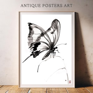 May include: Framed art print featuring a black and white butterfly illustration. The artwork, labeled "ANTIQUE POSTERS ART," showcases a detailed butterfly with open wings, rendered in a minimalist ink wash style. The print is set against a white background.