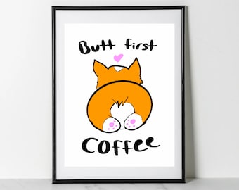 May include: A white framed print with a cartoon image of a corgi's rear end with the text "Butt first coffee" in black.