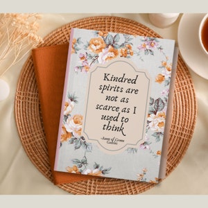 May include: A floral patterned notebook with a quote from Anne of Green Gables that reads "Kindred spirits are not as scarce as I used to think".