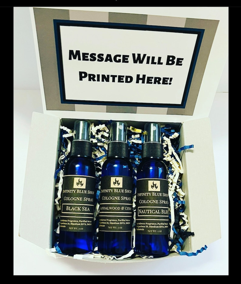 May include: A set of three blue cologne spray bottles in a gift box. The bottles are labeled "Black Sea", "Sandalwood & Citrus", and "Nautical Blue". Each bottle is 2 oz.