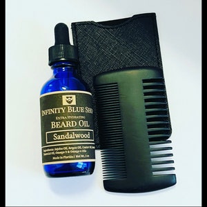 May include: A blue glass bottle of Infinity Blue Shop Extra Hydrating Sandalwood Beard Oil with a black dropper cap, a black comb, and a black textured pouch. The label lists ingredients and a net weight of 2 oz.
