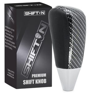May include: A premium shift knob with a carbon fiber pattern and a black top. The knob has a silver base and is packaged in a black box with the "SHIFTIN" logo and product details.