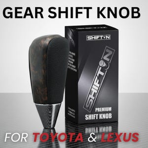 May include: A gear shift knob for Toyota and Lexus vehicles featuring a dark brown burl wood grain top, a black textured leather grip, and a polished silver metallic base. The product is displayed next to a black box labeled SHIFTN PREMIUM SHIFT KNOB.