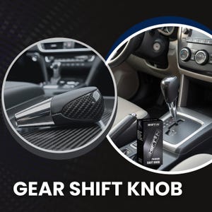 May include: A gear shift knob featuring a black carbon fiber pattern on the top section and a polished silver metallic base. The product is shown installed in a vehicle interior and inside a black box labeled SHIFT N PREMIUM SHIFT KNOB.
