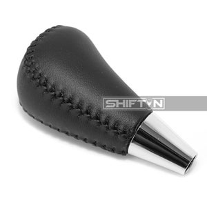 May include: Black leather shift knob with a chrome base. The shift knob has a stitched design and the text "SHIFT N" is visible on the side.