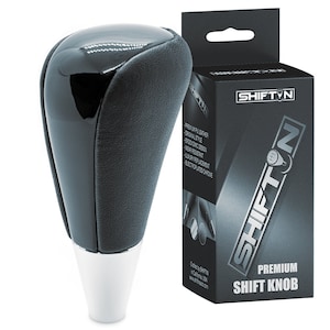 May include: Black leather shift knob with a chrome base. The knob is packaged in a black box with the brand name "SHIFTIN" and the text "PREMIUM SHIFT KNOB".
