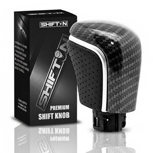 May include: A premium shift knob with a carbon fiber weave pattern and a black perforated grip. The product is packaged in a black box with the "SHIFT N" logo and the words "PREMIUM SHIFT KNOB".