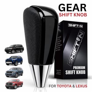 May include: A black gear shift knob with a textured side panel and a polished silver base. The product is displayed next to its black packaging box labeled SHIFTON PREMIUM SHIFT KNOB FOR TOYOTA & LEXUS, alongside images of four different vehicles.