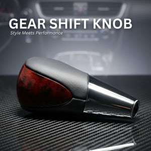 May include: Gear shift knob with a black leather top and a wood grain accent. The knob has a polished chrome base and the text "Gear Shift Knob" and "Style Meets Performance" in white.