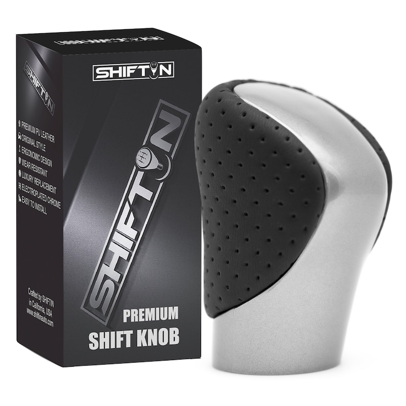May include: A silver and black gear shift knob with a perforated texture on the sides, positioned next to a black rectangular box labelled SHIFTN PREMIUM SHIFT KNOB, featuring text listing features like premium PU leather and electroplated chrome.