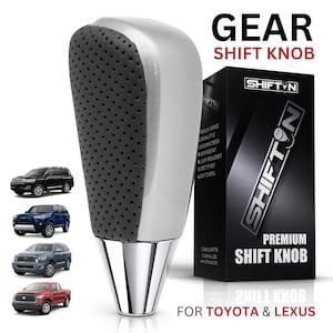 May include: A gear shift knob with a silver top and a black perforated leather-textured grip, featuring a polished chrome base. The product is displayed next to its black packaging box labeled SHIFTON PREMIUM SHIFT KNOB FOR TOYOTA & LEXUS.
