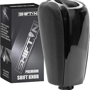 May include: Black leather shift knob with a chrome accent. The knob is packaged in a black box with the brand name "SHIFTN" printed on it. The box also says "Premium Shift Knob".