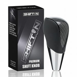 May include: A premium shift knob with a carbon fiber top and a black leather grip. The knob has a silver base and comes in a black box with the "SHIFT N" logo and product details.