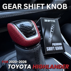 May include: A gear shift knob for a 2020-2026 Toyota Highlander featuring a red perforated leather grip, a carbon fiber top insert, and a silver trim border. The product is displayed next to its black packaging box labeled SHIFTN PREMIUM SHIFT KNOB.