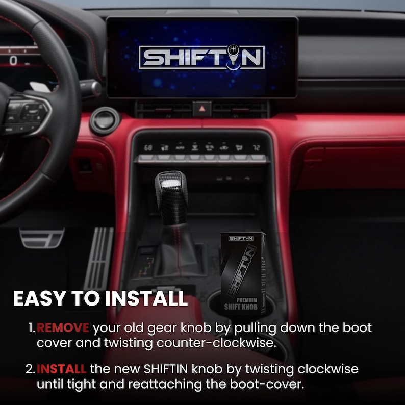 May include: A black gear shift knob with a carbon fibre texture installed in a vehicle centre console with red trim. The infotainment screen displays the SHIFT-N logo. A black product box labelled SHIFT-N PREMIUM SHIFT KNOB sits in the cup holder.