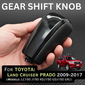 May include: A black gear shift knob with a glossy top and textured sides. The text reads: GEAR SHIFT KNOB, FOR TOYOTA: LAND CRUISER PRADO 2009-2017 (MODELS: LC150 J150 KDJ150 GDJ150 GRJ). A small red SUV is pictured next to the text.