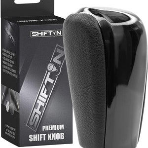 May include: Black leather and chrome shift knob with a silver logo that says "SHIFTN". The knob is packaged in a box with the same logo and the words "Premium Shift Knob".