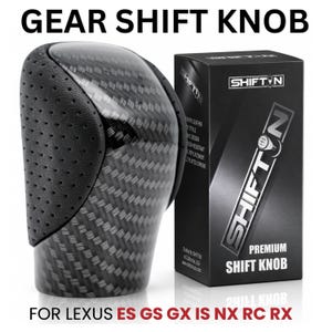 May include: A black carbon fiber gear shift knob with perforated leather side panels, accompanied by a black product box labeled SHIFTON. The text GEAR SHIFT KNOB FOR LEXUS ES GS GX IS NX RC RX is displayed in black and red lettering.