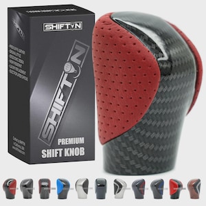 May include: A premium shift knob with a carbon fiber design and red perforated leather accents. The product is packaged in a black box with the "SHIFTIN" logo and product information. Several other shift knob designs are displayed below.