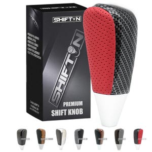May include: A premium shift knob with a carbon fiber and red leather design. The shift knob has a white base and is accompanied by a black box with the "SHIFT N" logo and product details. Several other shift knob designs are shown below.