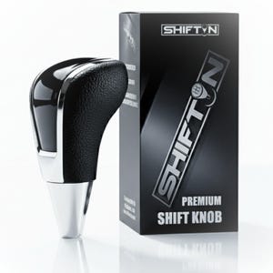 May include: A premium shift knob with a black leather grip and a shiny chrome finish. The shift knob is next to a black box with the text "SHIFT N PREMIUM SHIFT KNOB".