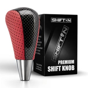 May include: A gear shift knob featuring a black carbon fiber center panel flanked by red perforated leather sides and a silver metallic base. It is displayed next to a black product box labeled SHIFTIN PREMIUM SHIFT KNOB with white text.