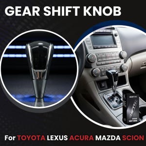 May include: A black and silver gear shift knob with the text "GEAR SHIFT KNOB" at the top. The image also includes the text "For TOYOTA LEXUS ACURA MAZDA SCION". The shift knob is shown in a car interior.