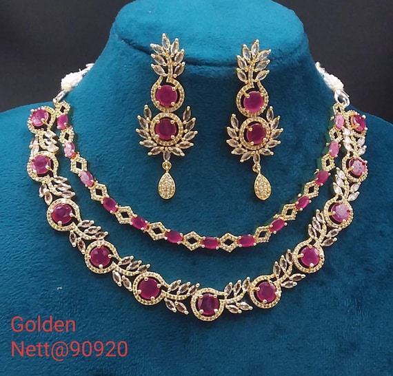 premium gold Plated Sleek Double line NECKLACE Set CZ Stone Made Ethnic Indian Bridal Combo Necklace with  Earring American Diamond Set
