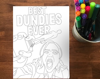 May include: Black and white line art coloring page with the text "BEST DUNDIES EVER" and a person holding a trophy. A metal container filled with colorful markers sits to the right on a wooden surface.