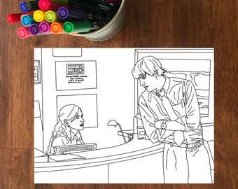 May include: Black and white line art print of a scene from The Office TV show, featuring two characters at a reception desk. The print includes the "Dunder Mifflin" logo and text. A metal container of colorful markers sits above the print.
