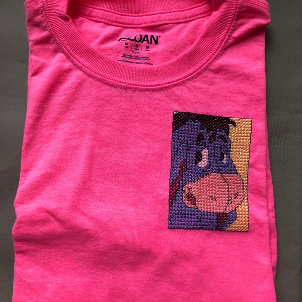 Pink youth T-shirt with cross stitched picture of Eyore