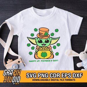 May include: A white t-shirt with a green and yellow cartoon character wearing a green hat and holding a pot of gold. The character is surrounded by green shamrocks. The text "Happy St. Patrick's Day!" is printed below the character.