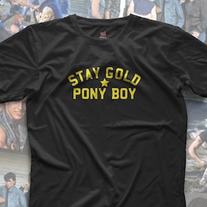 May include: Black t-shirt with a gold graphic that says "Stay Gold Pony Boy" with a star.