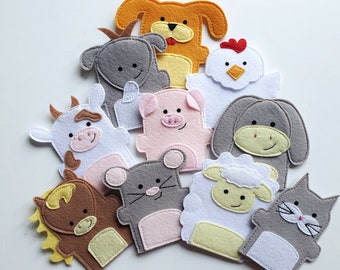 May include: A set of ten felt finger puppets featuring various farm animals, including a cow, pig, sheep, horse, chicken, cat, dog, mouse, goat, and donkey. The puppets are all brightly colored and have friendly faces.