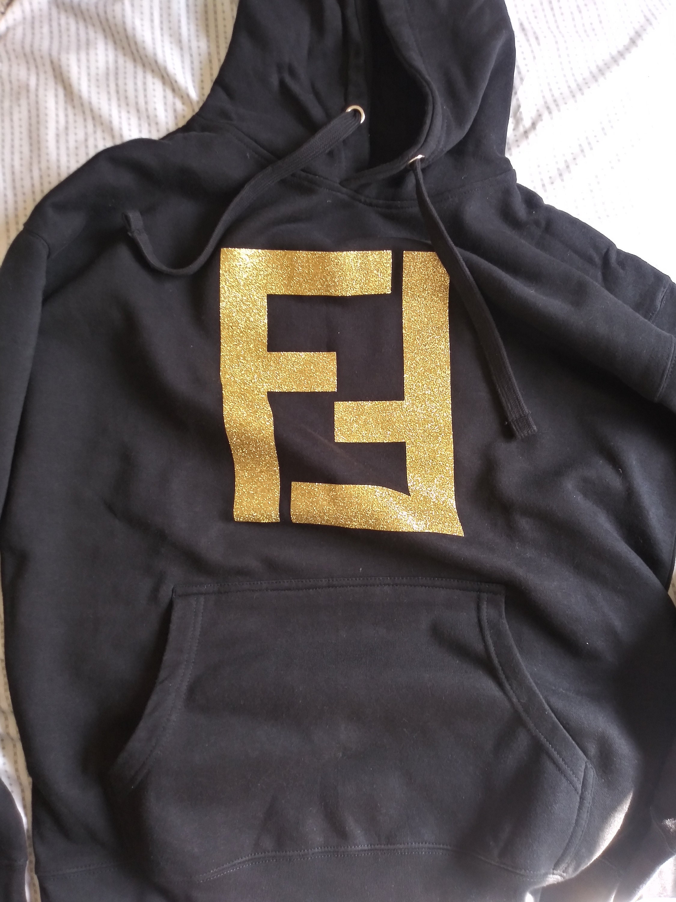 black and metallic gold hoodie