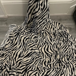 1manimal pleated zebra  strech  fabric 58" wide