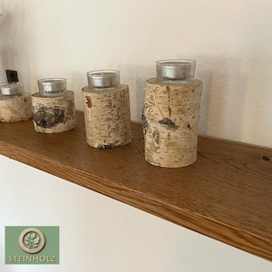 Floating oak shelf – natural and robust. Invisible mounting, ideal for books, plants, and decorations. Color finishes available.