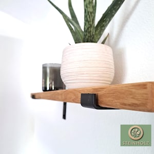 Wild oak wall shelf with industrial supports – handcrafted, modern, and timeless. Perfect for books, plants, and decorations. Custom sizes available.