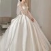 Elegant A line Wedding Dresses Illusion O Neck Long Sleeves Pearls Beads Detail designer Bridal Gowns Custom De Mariee