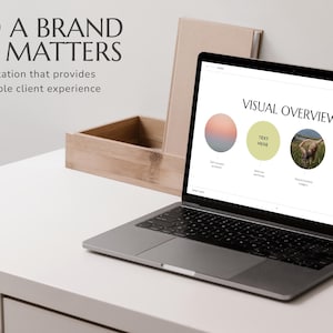 May include: A laptop computer displaying a presentation slide with the title "Visual Overview". The slide has four sections with different visual elements, including a gradient circle, a circle with the text "Text Here", a photo of a field, and a circle with a flower design.