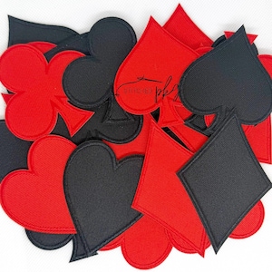 May include: A collection of embroidered playing card suit patches in red and black. The set includes heart, diamond, club, and spade shapes with stitched borders. A faint watermark text reading Stitched is visible across the center.